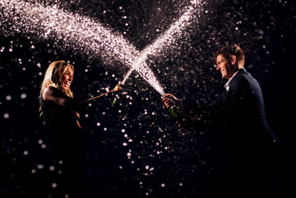 newlyweds popping champagne corks inspired by other photographers work