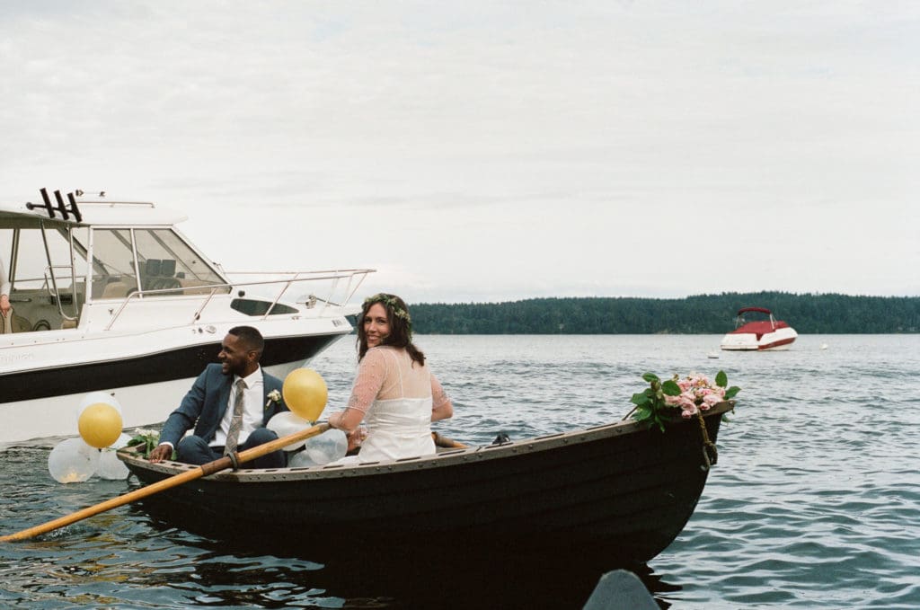 Water's Edge Wedding with rowboats and yachts.