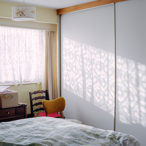 A sample image photographed with a Hasselblad 500CM shows light coming through a lace curtain onto a bedroom wall