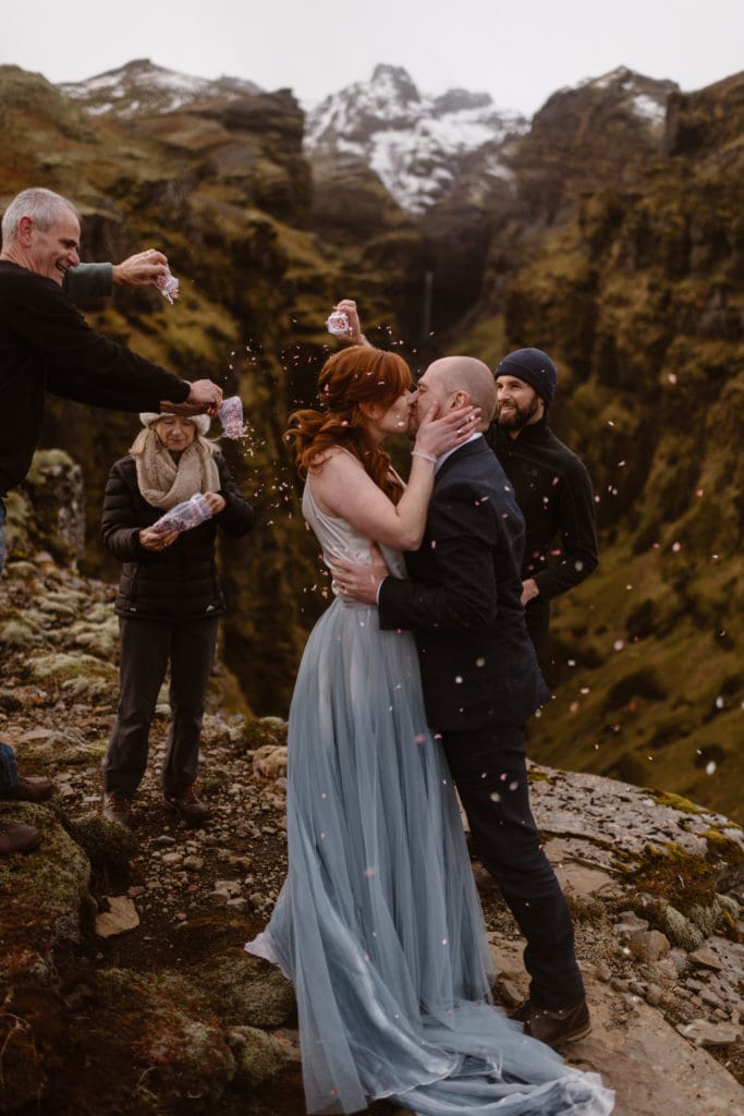 couple kisses at their ceremony during all-day elopement by adventure instead