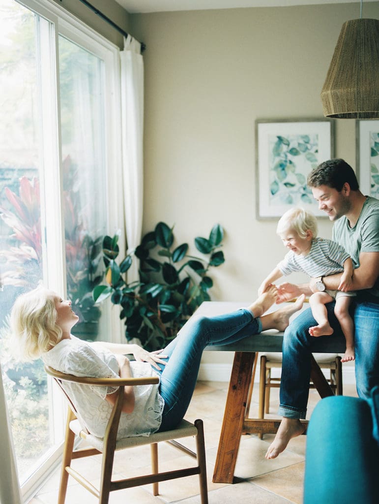 furniture is used to create levels and layering for family portrait.