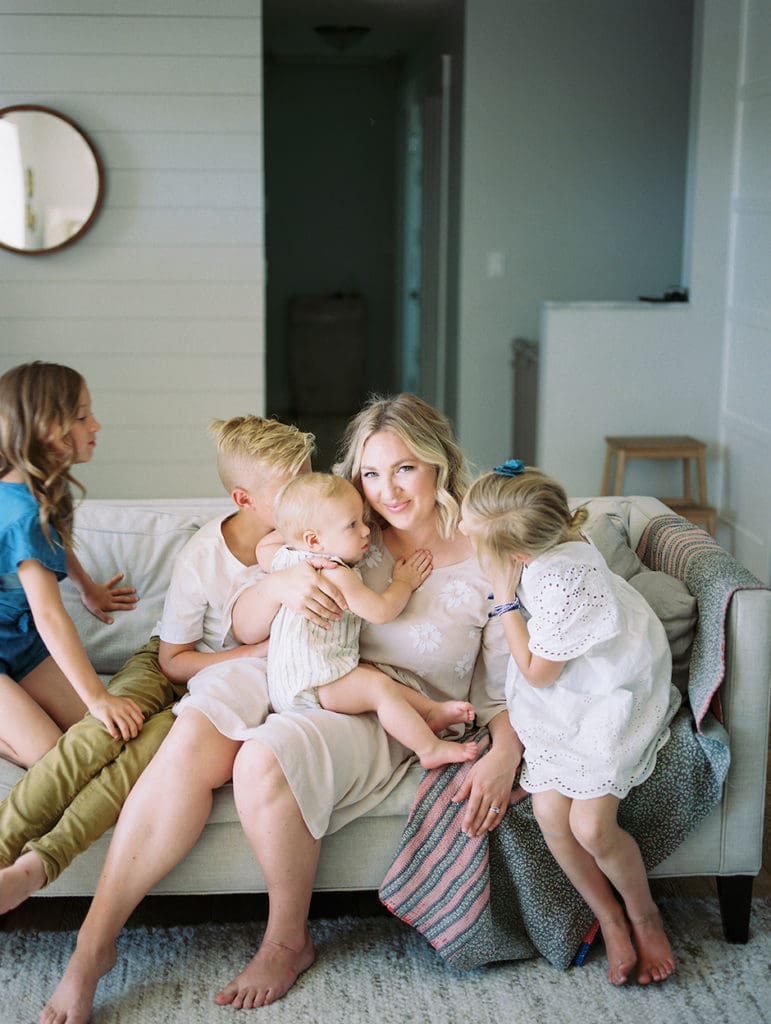 mom and children in a "perch" on couch.