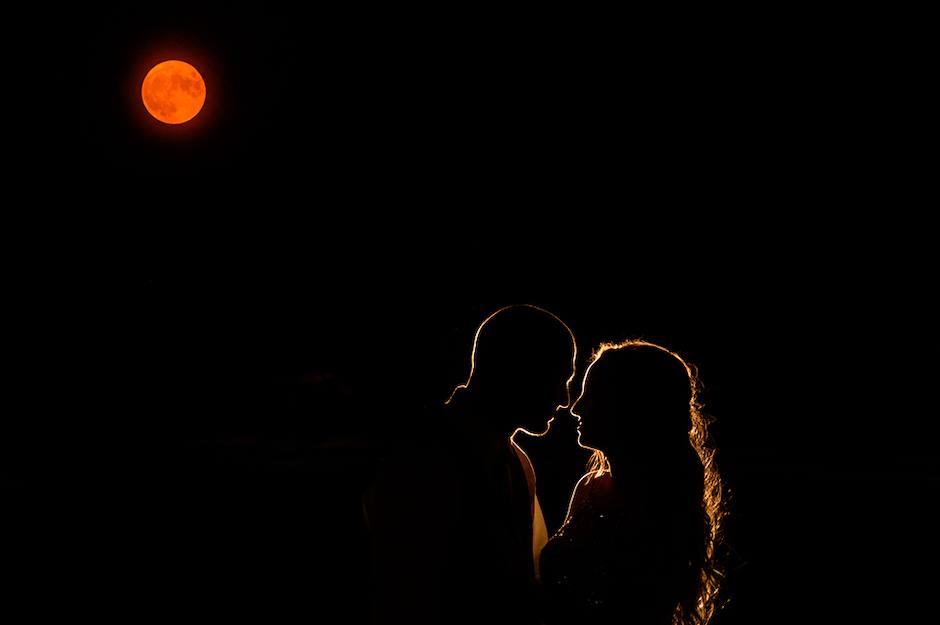 Silhouette of couple with flash placed 15 feet behind them.