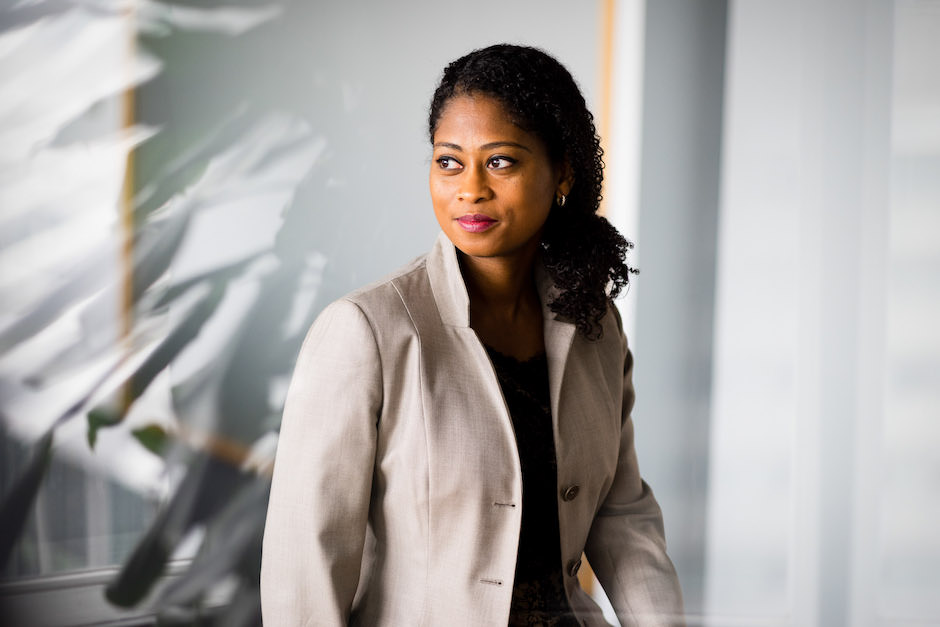 A corporate portrait doesn't have to be bland. Posing, lighting and background elements help.
