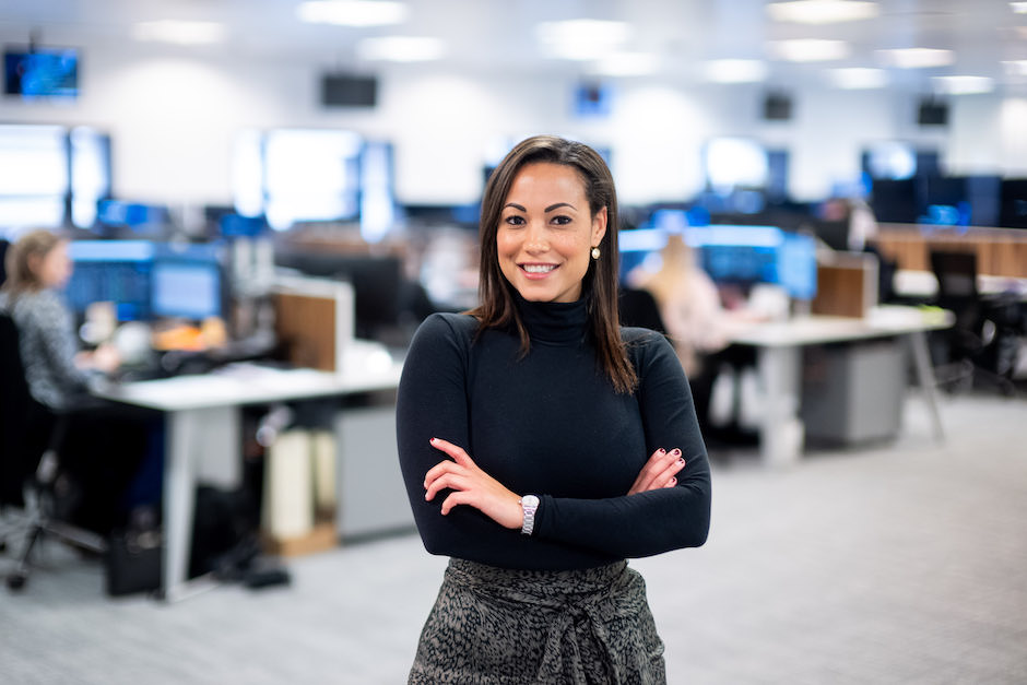corporate photography in an office setting can add blur to background and focus on main subject.