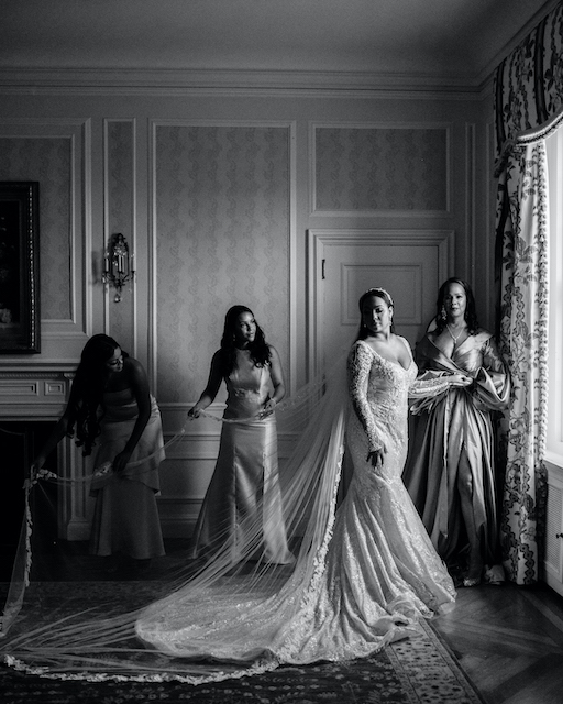 Directional window light image of bride and bridesmaids.