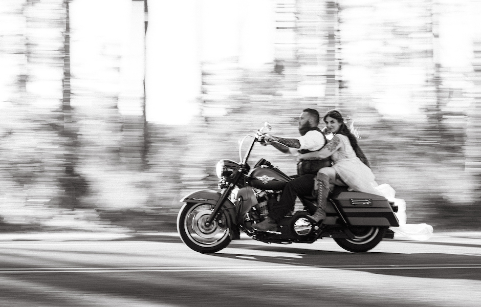 bride and groom on motorcycle.
