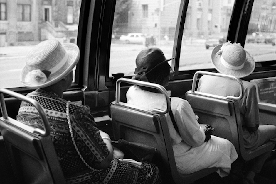 image of three women on a bus, by Jamal Shabazz.