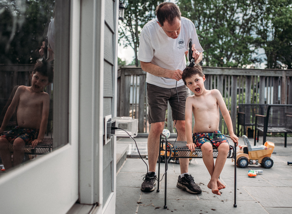 getting your photography noticed can start with an everyday image of a kid getting haircut by his dad.