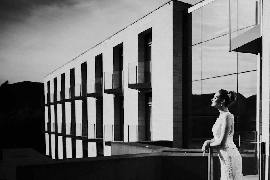 image of bride against hotel's interesting architecture.