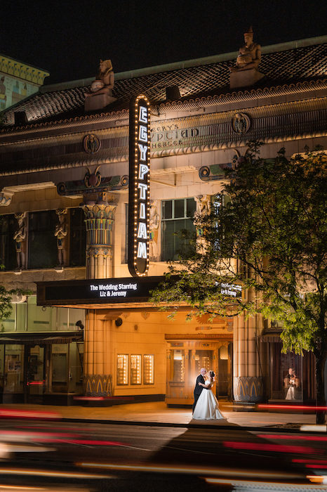 Bride and groom in front of The Egyptian Theater in L.A.