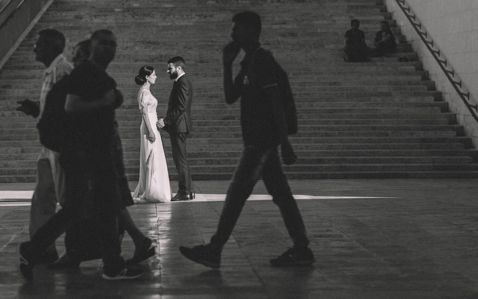 bride and groom in train station