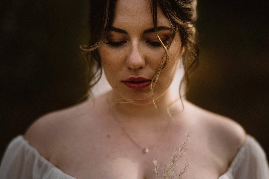 beautiful bride reflects before ceremony.