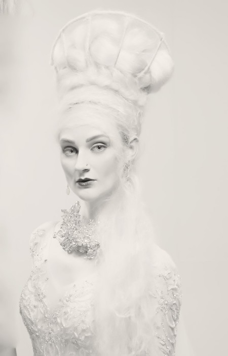 Portrait of magnificent headdress and model.