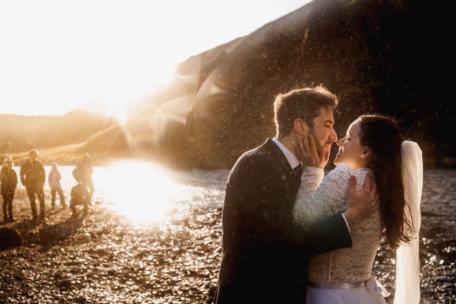bride and groom at Iceland waterfalls.