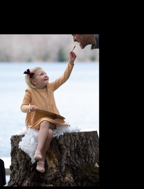 Before image of little girl on tree stump.