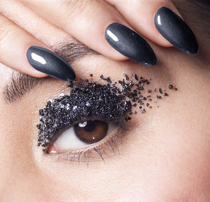 creative beauty shot with rocks on eyelid