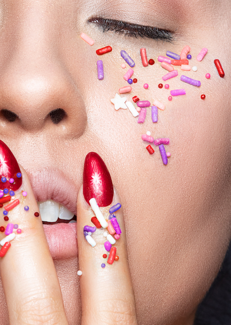creative image with sprinkles on girl's face.