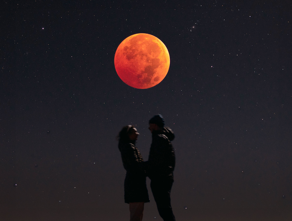 elopement couple under blood moon.