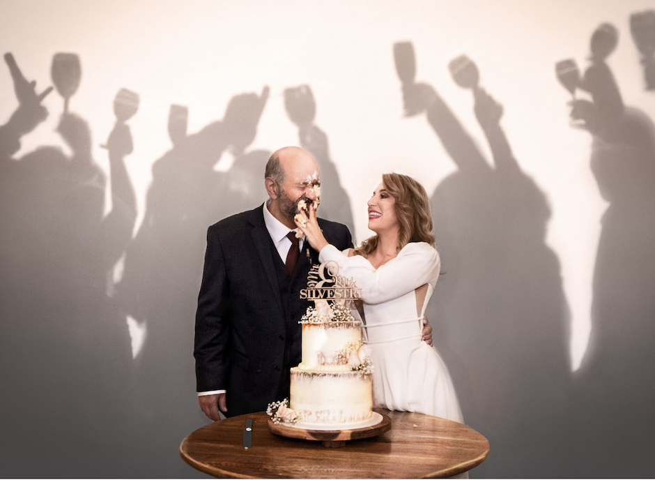 couples in love theme for portrait of bride and groom cutting cake.