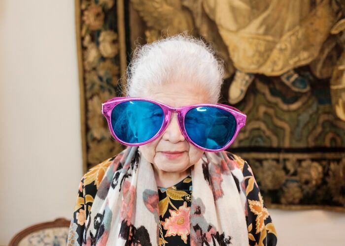 weekly photo updates includes this image of gray-haired lady with oversized glasses
